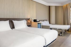 a hotel room with two beds in a room at AC Hotel by Marriott Tenerife in Santa Cruz de Tenerife