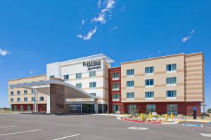 a hotel building with a parking lot in front of it at Fairfield Inn & Suites by Marriott Tucumcari in Tucumcari