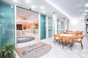 a dining room with a table and chairs at Hotel Continental in Gatteo a Mare