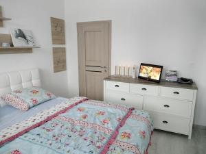 A bed or beds in a room at Čarovný Liptovský Ján - balzam na dušu