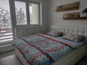 A bed or beds in a room at Čarovný Liptovský Ján - balzam na dušu