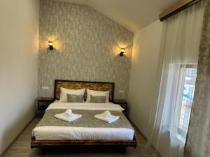 Voodi või voodid majutusasutuse WaterFall Hotel toas