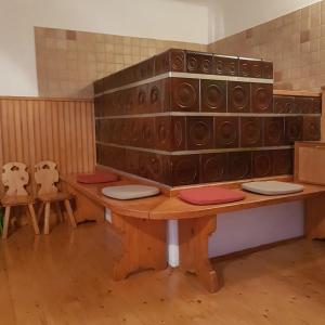 a room with a table with a bunch of speakers at Miklavževa hiša with a bread oven in Železniki