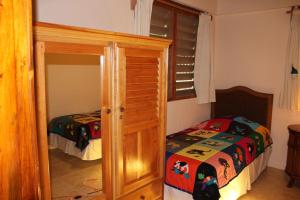 Postel nebo postele na pokoji v ubytování Villas Pico Bonito