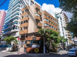 a bus is parked in front of a building at Flat Beverly Hills 101A in Vila Velha