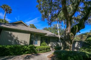 a house with a tree in front of it at Surfscoter in Johns Island