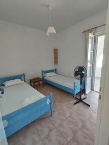 A bed or beds in a room at CIELO Summer House Paros