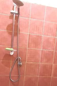 a shower with a shower head in a bathroom at 2 chambres-salon-cuisine-balcons sup 80m2 in Dakar