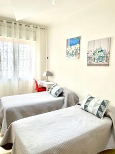 Postel nebo postele na pokoji v ubytování Casa De Curtis