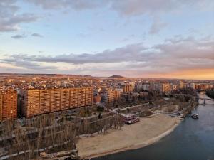 an aerial view of a city with a river and buildings at Loft estilo industrial a 5 minutos del centro in Valladolid