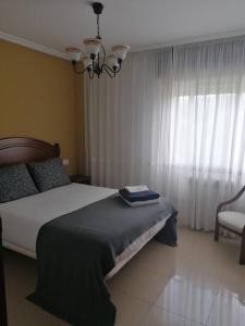 Кровать или кровати в номере O Lar do Suso
