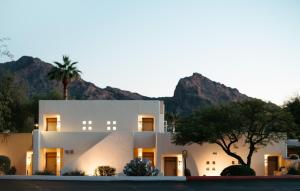 a white house with a mountain in the background at JW Marriott Scottsdale Camelback Inn Resort & Spa in Scottsdale