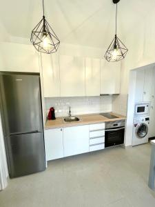 A kitchen or kitchenette at Villa Paraiso