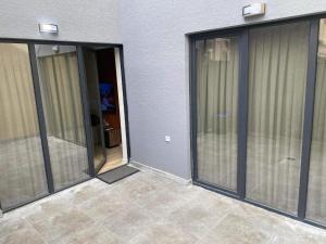 a group of sliding glass doors on a patio at Bego Residence in Bitola