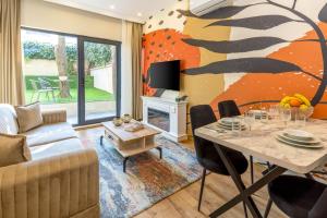 a living room with a couch and a table at BayMari Suites Plus Florya in Istanbul