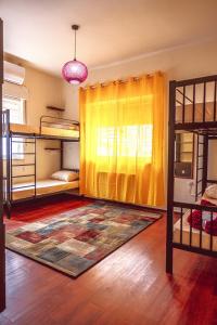 a bedroom with bunk beds and a rug at Ramallah Hostel in Ramallah