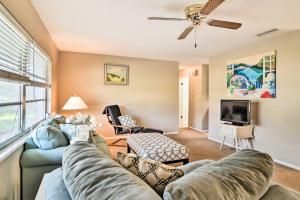 a living room with a couch and a tv at Bradenton Snowbird Sanctuary with Covered Patio and Grill in Bradenton