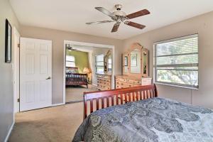 a bedroom with a bed and a ceiling fan at Bradenton Snowbird Sanctuary with Covered Patio and Grill in Bradenton
