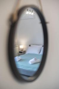 a reflection of a bed in a mirror at Kos Helios House in Psalidi
