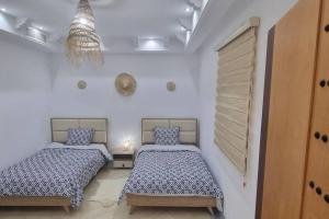 Postel nebo postele na pokoji v ubytování Villa des Lotophages