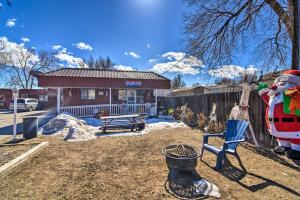 a yard with a bench and a building at Pet-Friendly Vacation Rental Near Boyd Lake in Loveland