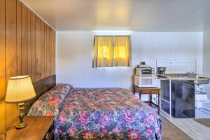 a hotel room with a bed and a kitchen at Pet-Friendly Vacation Rental Near Boyd Lake in Loveland