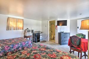 a hotel room with two beds and a television at Pet-Friendly Vacation Rental Near Boyd Lake in Loveland +17 photos