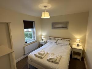 En eller flere senge i et værelse på Coral Shores