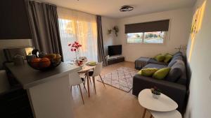 a living room with a couch and a table at Apartment in Mar Menor Golf Resort in Torre-Pacheco