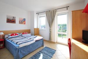 Postel nebo postele na pokoji v ubytování Villa Pod Żaglami
