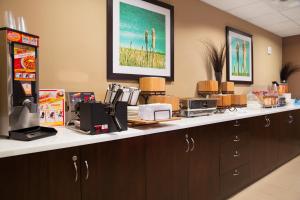 a counter in a office with a coffee shop at Microtel Inn & Suites by Wyndham Blackfalds in Blackfalds