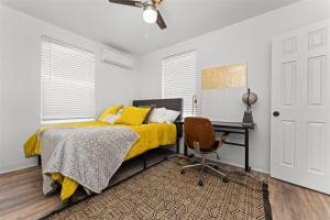 a bedroom with a bed and a desk and a chair at 18th Street B in Boise