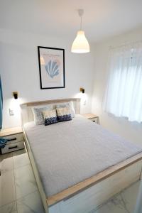 A bed or beds in a room at Panoráma házikó