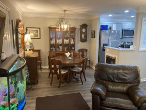 a living room with a table and chairs and a kitchen at Secluded 3 bed 2 bath condo in Athens close to Five-Points in Athens