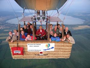 a group of people flying in a hot air balloon at RÉKA háziállatbarát nyaraló in Keszthely