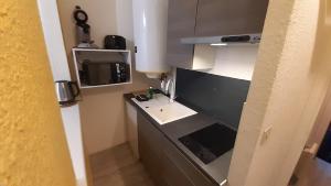 Kuchyňa alebo kuchynka v ubytovaní Studio 302 au 15 rue Battant à Besançon