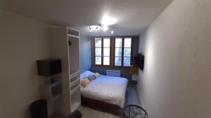 Posteľ alebo postele v izbe v ubytovaní Studio 302 au 15 rue Battant à Besançon