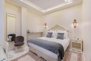 Postel nebo postele na pokoji v ubytování HOTEL RIAD CHAMI