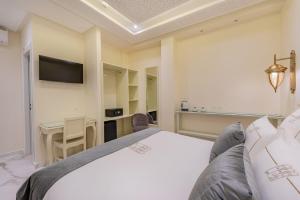 Postel nebo postele na pokoji v ubytování HOTEL RIAD CHAMI