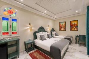 Postel nebo postele na pokoji v ubytování HOTEL RIAD CHAMI