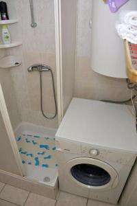a shower with a washing machine in a bathroom at Apartments with parking space Krapinske Toplice, Zagorje - 20688 in Krapinske Toplice