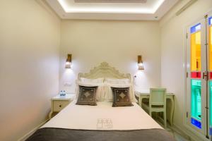 Postel nebo postele na pokoji v ubytování HOTEL RIAD CHAMI