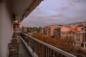 a balcony with a view of a city at The Parthenon Terrace ReNoVaTeD with a view ! in Athens