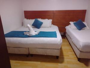 Postel nebo postele na pokoji v ubytování Hotel Casa Lamay
