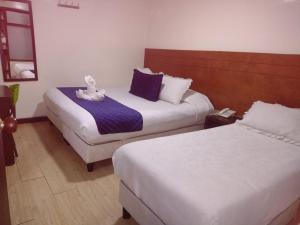 Postel nebo postele na pokoji v ubytování Hotel Casa Lamay
