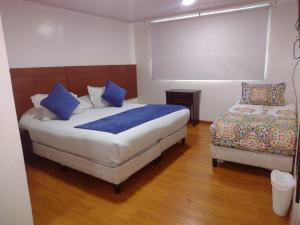 Postel nebo postele na pokoji v ubytování Hotel Casa Lamay