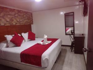 Postel nebo postele na pokoji v ubytování Hotel Casa Lamay