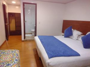 Postel nebo postele na pokoji v ubytování Hotel Casa Lamay