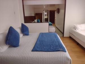 Postel nebo postele na pokoji v ubytování Hotel Casa Lamay