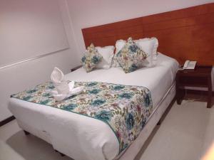 Postel nebo postele na pokoji v ubytování Hotel Casa Lamay
